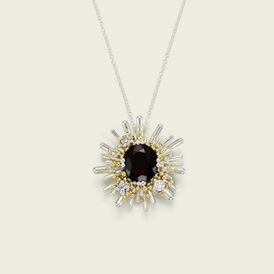 My client inherited a diamond engagement ring, a gold wedding band, and a garnet dress ring from her mother. It was a joy to transform these treasured pieces into a meaningful pendant, inspired by my Sea Urchin brooch. The result is a new wearable heirloom—rich with memory.